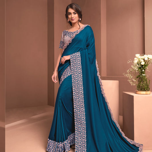 Teal Blue Colored Silk Georgette Embroidered Saree With Stitched Blouse.